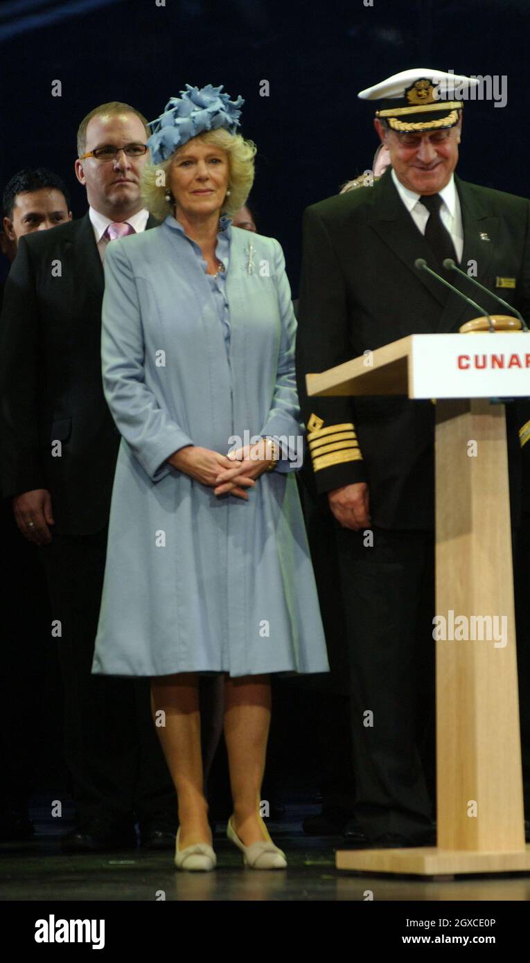 Camilla, Duchess of Cornwall with Captain Paul Wright on stage at the naming ceremony of the Cunard liner Queen Victoria on December 10, 2007 in Southampton. The ship was officially named by the Duchess of Cornwall. Stock Photo