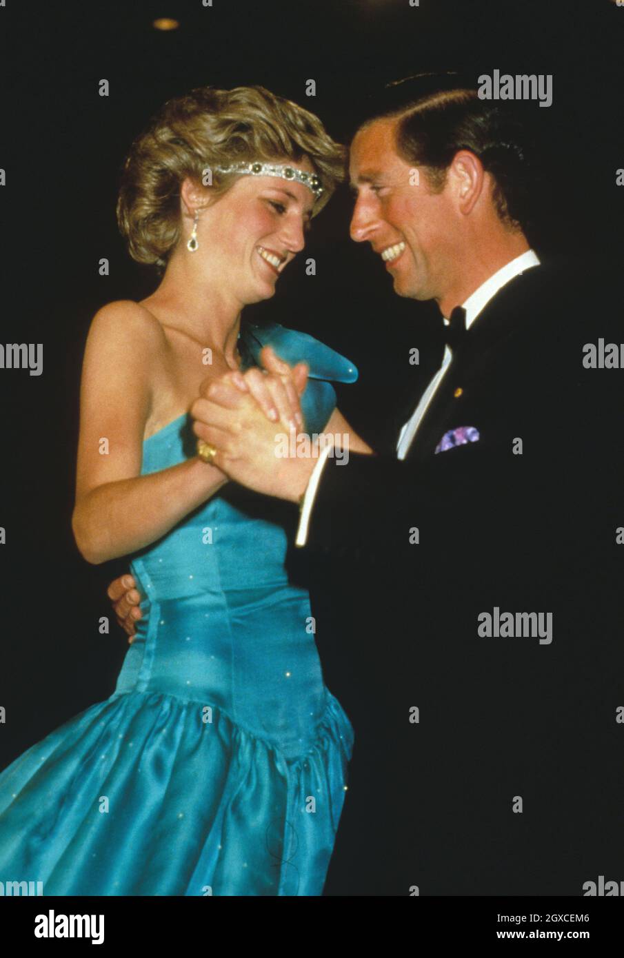 Princess Diana wears an Emanuel dress while dancing in Australia with Prince Charles Stock Photo