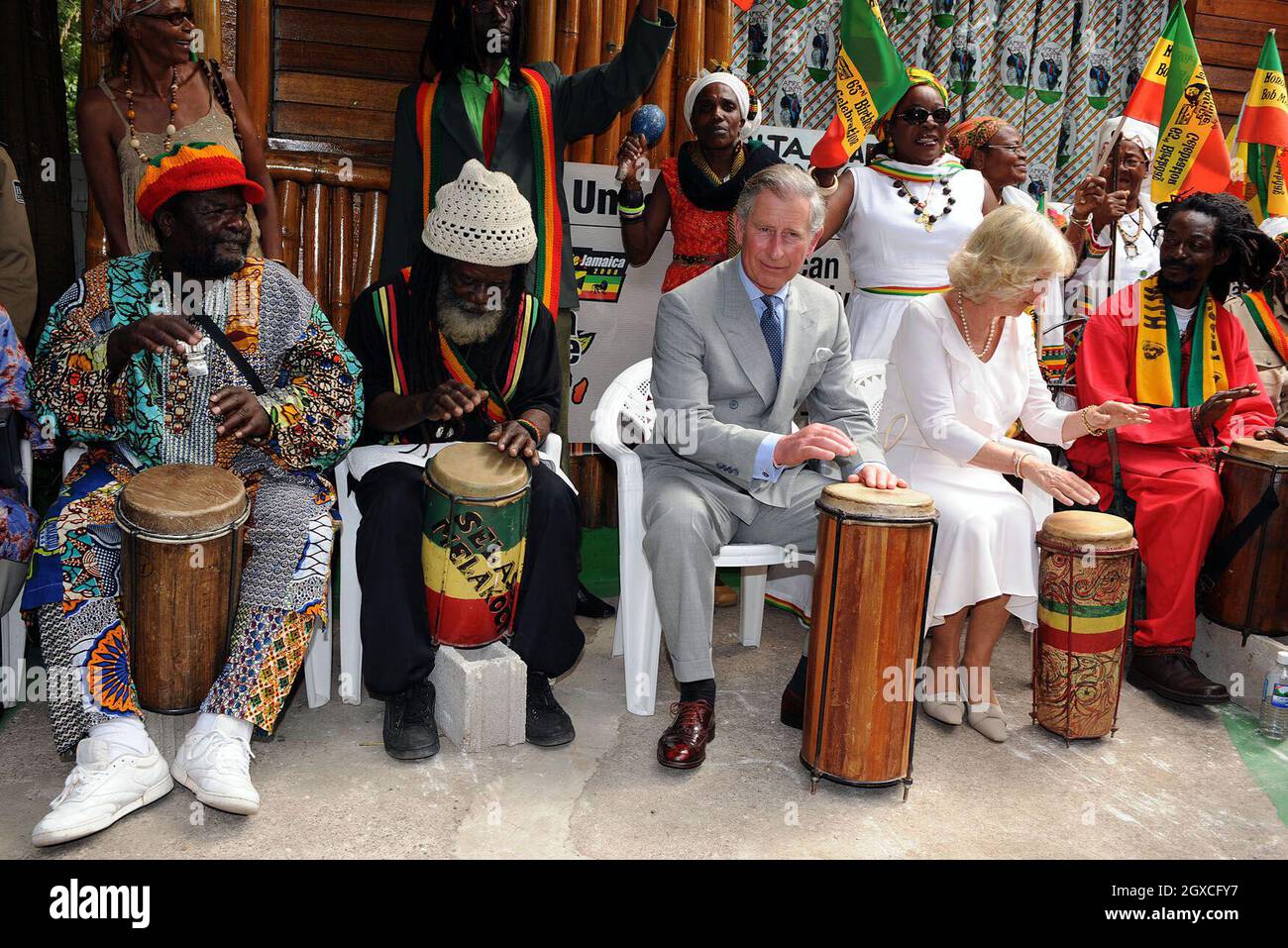 Prince Charles, Prince of Wales and Camilla, Duchess of Cornwall play the bongo drums as they join a group of musicians at the former home, now a museum, of musician Bob Marley in Kingston, Jamaica. Stock Photo