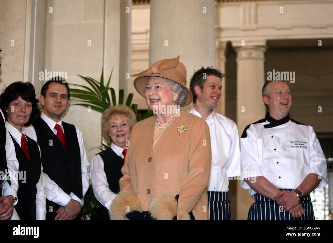 Queen Elizabeth II meets the catering staff following a reception and lunch at the Guildhall in Swansea. Stock Photo