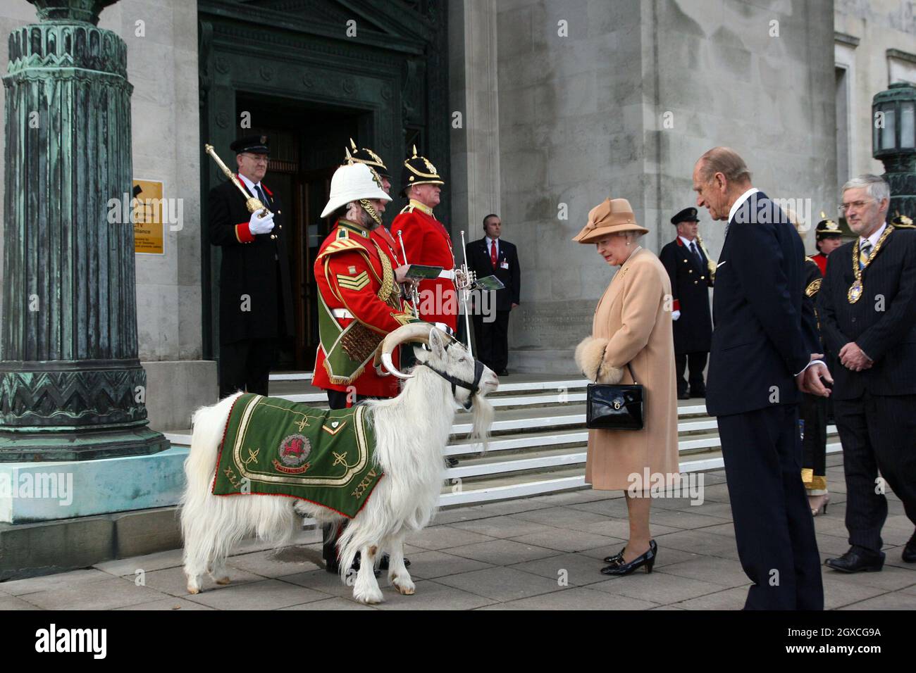 Queen Elizabeth II and Prince Philip, Duke of Edinburgh admire the ceremonial goat as they arrive at the Guildhall in Swansea. Stock Photo