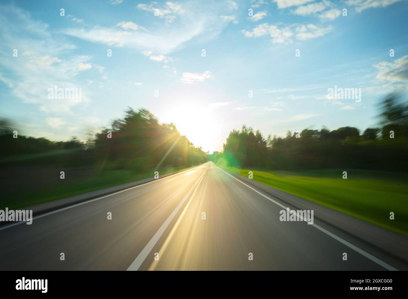 A journey through the rural road to the sun, motion blur Stock Photo