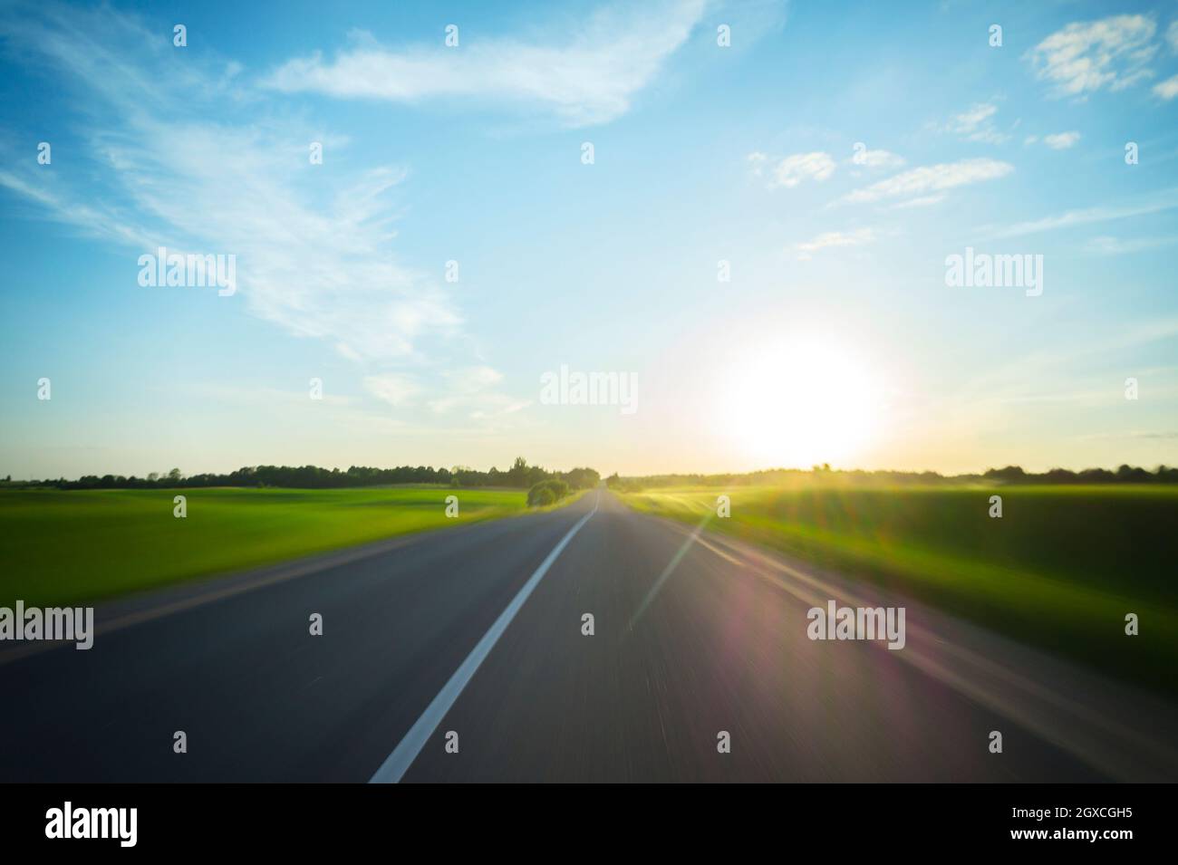 A journey through the rural road to the sun, motion blur Stock Photo