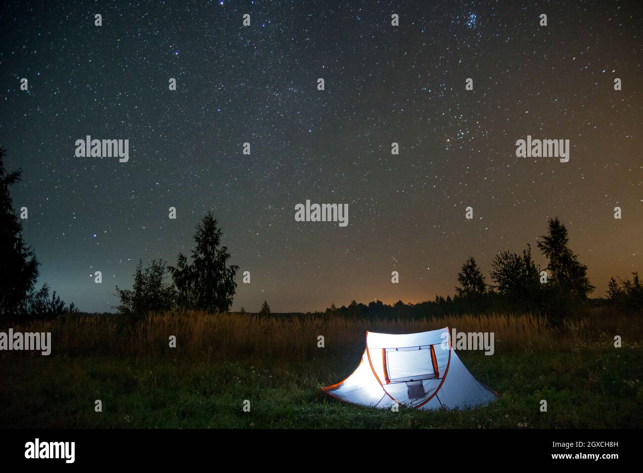 Tent under a starry sky Stock Photo - Alamy