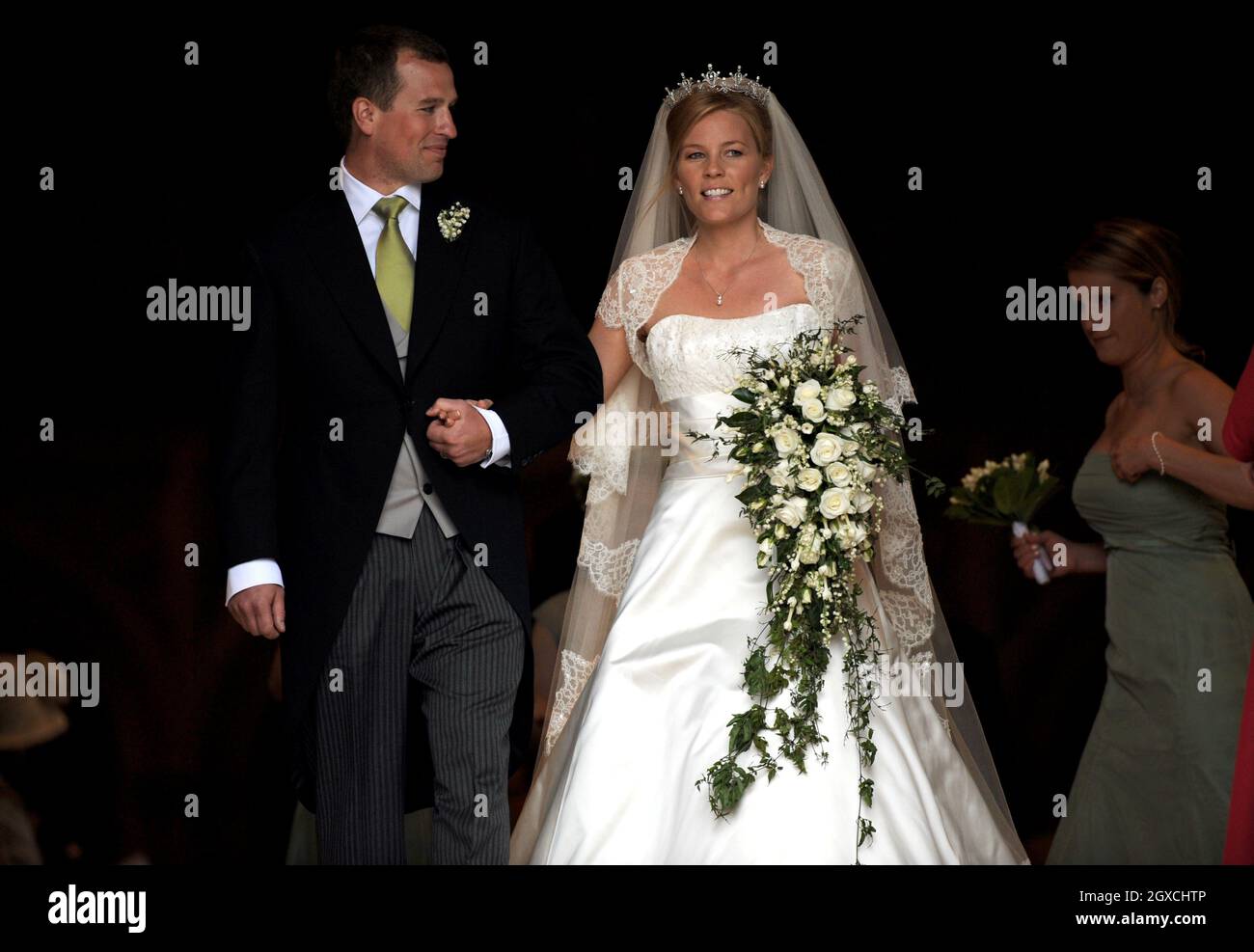 Peter Phillips and Autumn Kelly leave St. George's Chapel after their marriage ceremony at Windor Castle, Windsor. Stock Photo