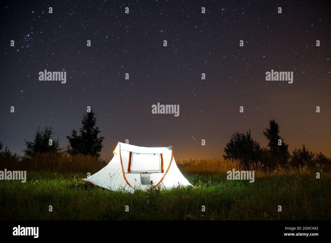 Tent under a starry sky Stock Photo - Alamy