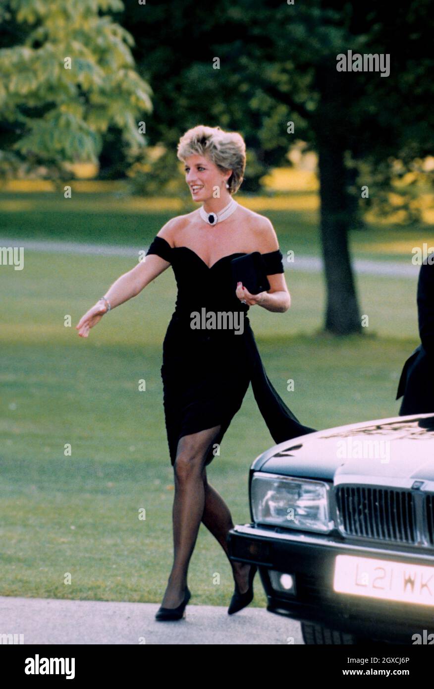 Diana, Princess of Wales wearing a black pleated chiffon dress, with floating side panel, by Christina Stamboulian, during a party given at the Serpentine Gallery in London Stock Photo