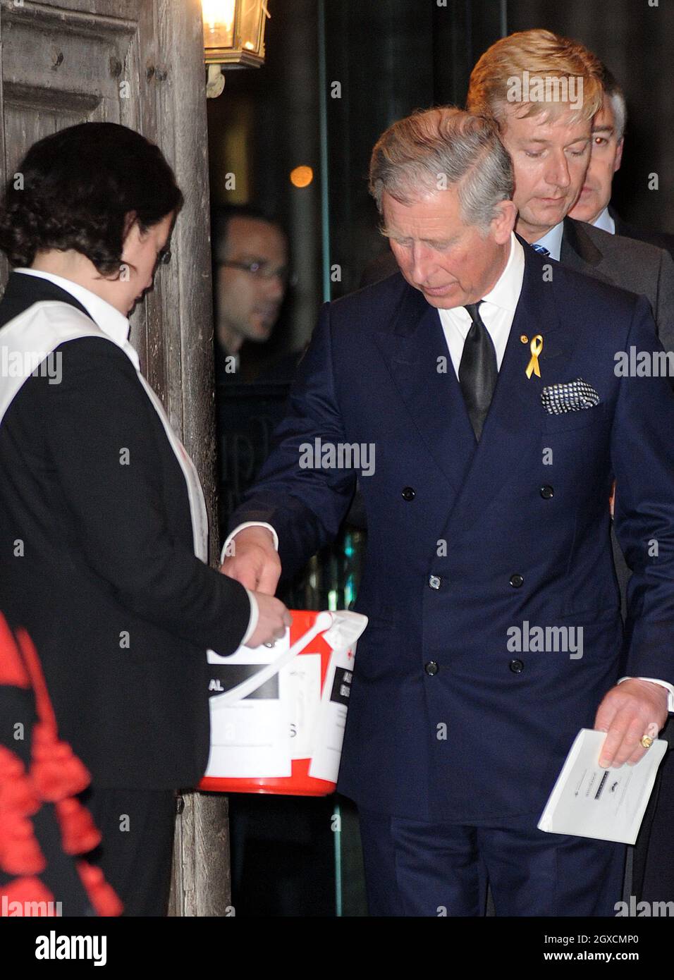 Prince Charles Prince Of Wales Gives A Donation While Leaving A