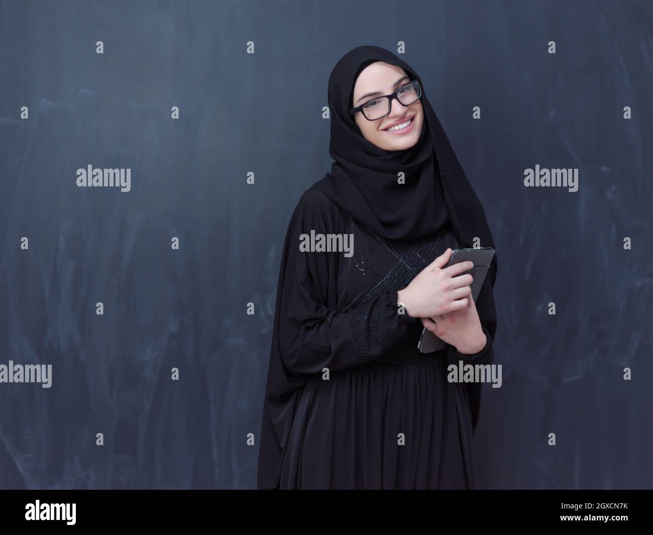 young modern muslim business woman using tablet computer wearing ...