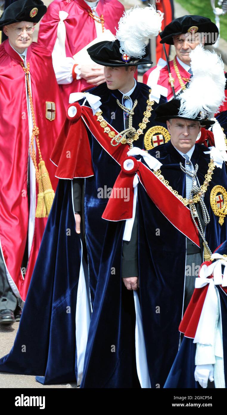 Prince William (C) and Prince Andrew, Duke of York (R) arrive for the