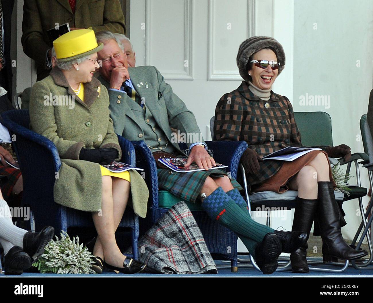 Queen Elizabeth II, Prince Charles, Prince of Wales and Princess Anne, Princess Royal watch the events at the 2009 Braemar Highland Games on September 5, 2009 in Braemar, Scotland. The Braemar Gathering is world famous with thousands of visitors descending on the small Scottish village each year to watch the Games, a Scottish Tradition stretching back hundreds of years. Stock Photo