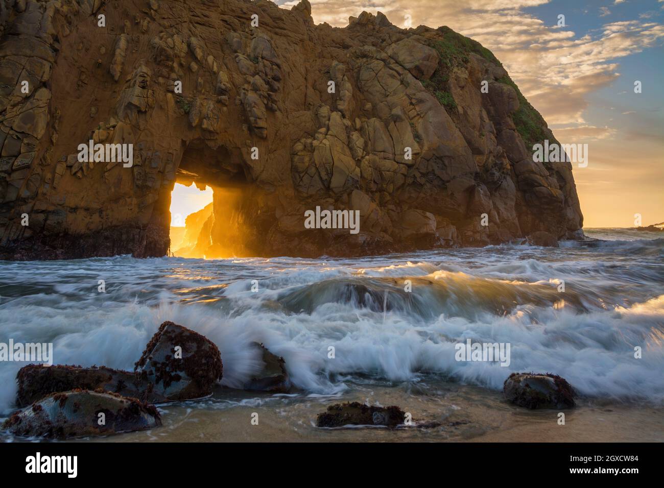 Big Sur Pfeiffer Beach Arch At Sunset CA World Location USA. Stock Photo