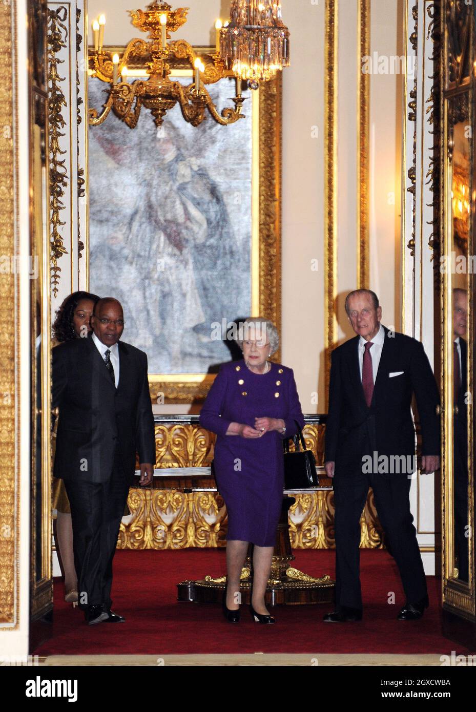 Britain's Queen Elizabeth II, Prince Philip, Duke of Edinburgh, President of South Africa Jacob Zuma and Mrs Zuma look at at an exhibition of South African related items at Buckingham Palace in London as part of the President's three-day state visit. Stock Photo