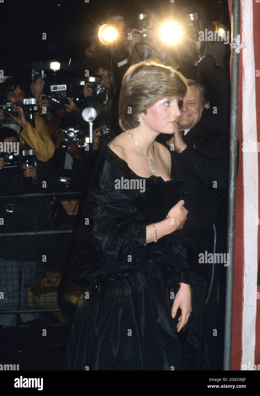 **FILE PHOTO** Lady Diana Spencer, later to become Diana, Princess of Wales, sets the flashbulbs popping as she wears a revealing Emanuel black dress attending her first official engagement with Prince Charles at a fundraising concert at the Goldsmiths Hall in London in March 1981. Designers Elizabeth and David Emanuel are holding an auction of dresses worn by the late Princess Diana. The dresses are to go up for auction on June 8, 2010 in London, at specialist vintage fashion auctioneers Kerry Taylor Auctions.  Stock Photo