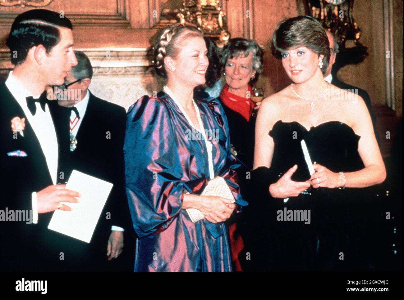 **FILE PHOTO** Lady Diana Spencer, later to become Diana, Princess of Wales, sets the flashbulbs popping as she wears a revealing Emanuel black dress attending her first official engagement with Prince Charles, and Princess Grace of Monaco, at a fundraising concert at the Goldsmiths Hall in London in March 1981. Designers Elizabeth and David Emanuel are holding an auction of dresses worn by the late Princess Diana. The dresses are to go up for auction on June 8, 2010 in London, at specialist vintage fashion auctioneers Kerry Taylor Auctions.  Stock Photo
