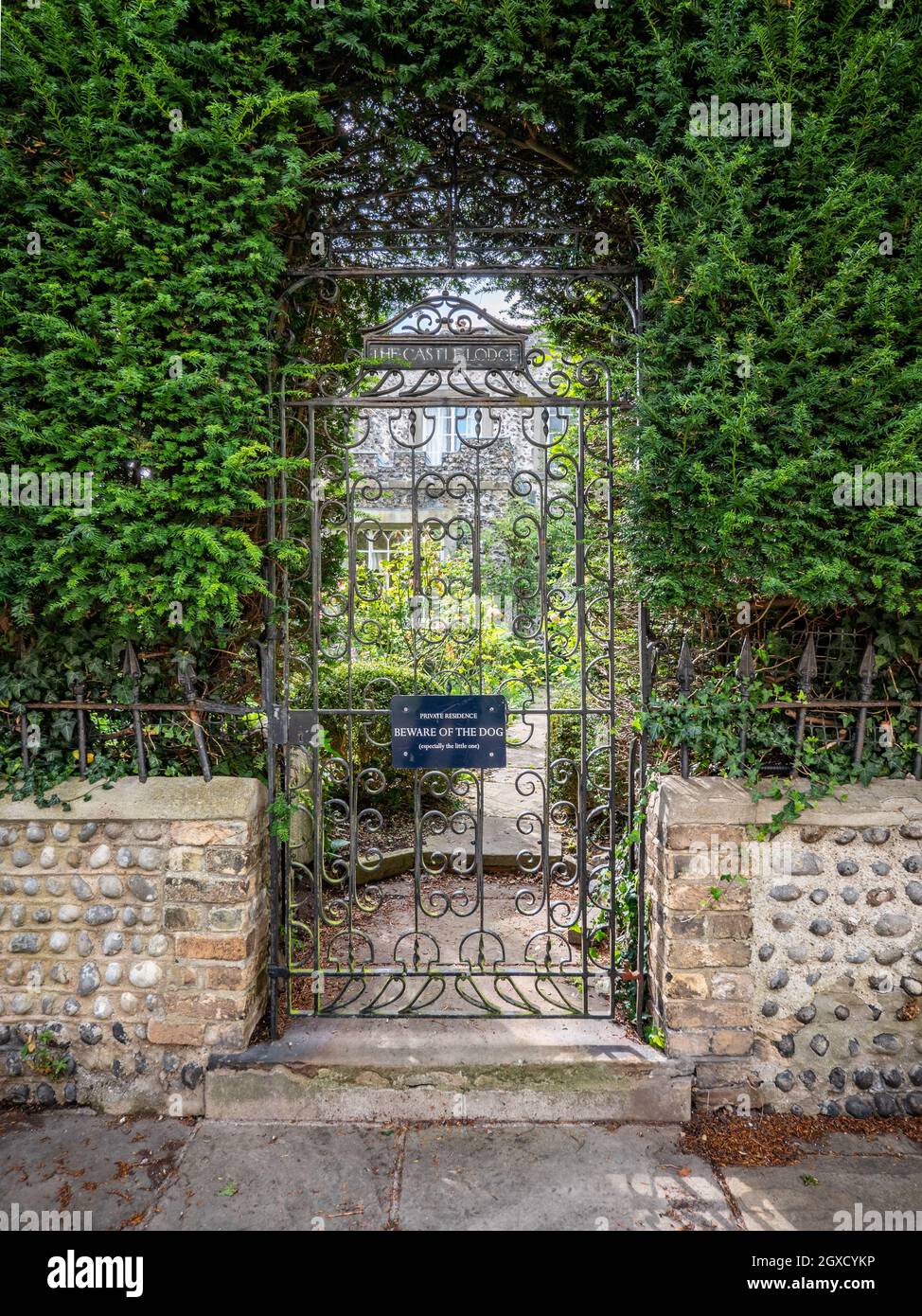 English Country Garden. A secure wrought iron gate leading into the ...