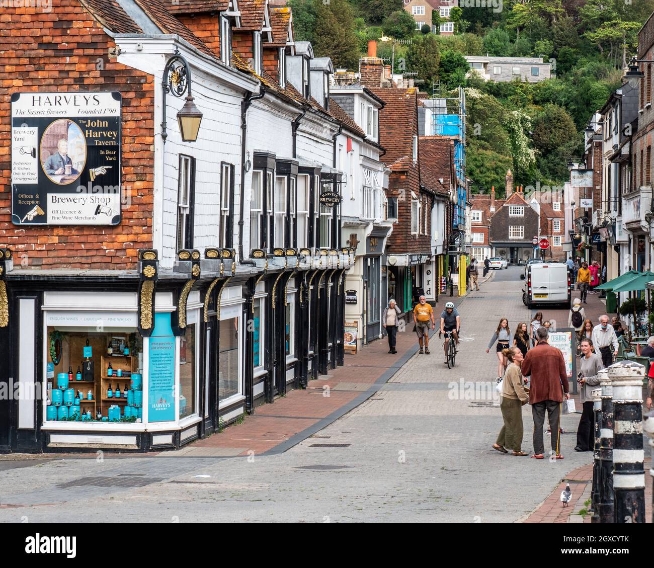 High Street, Lewes, East Sussex, England. The main shopping street in the Cliffe area of Lewes with focus on the local Harvey's Brewery shop. Stock Photo