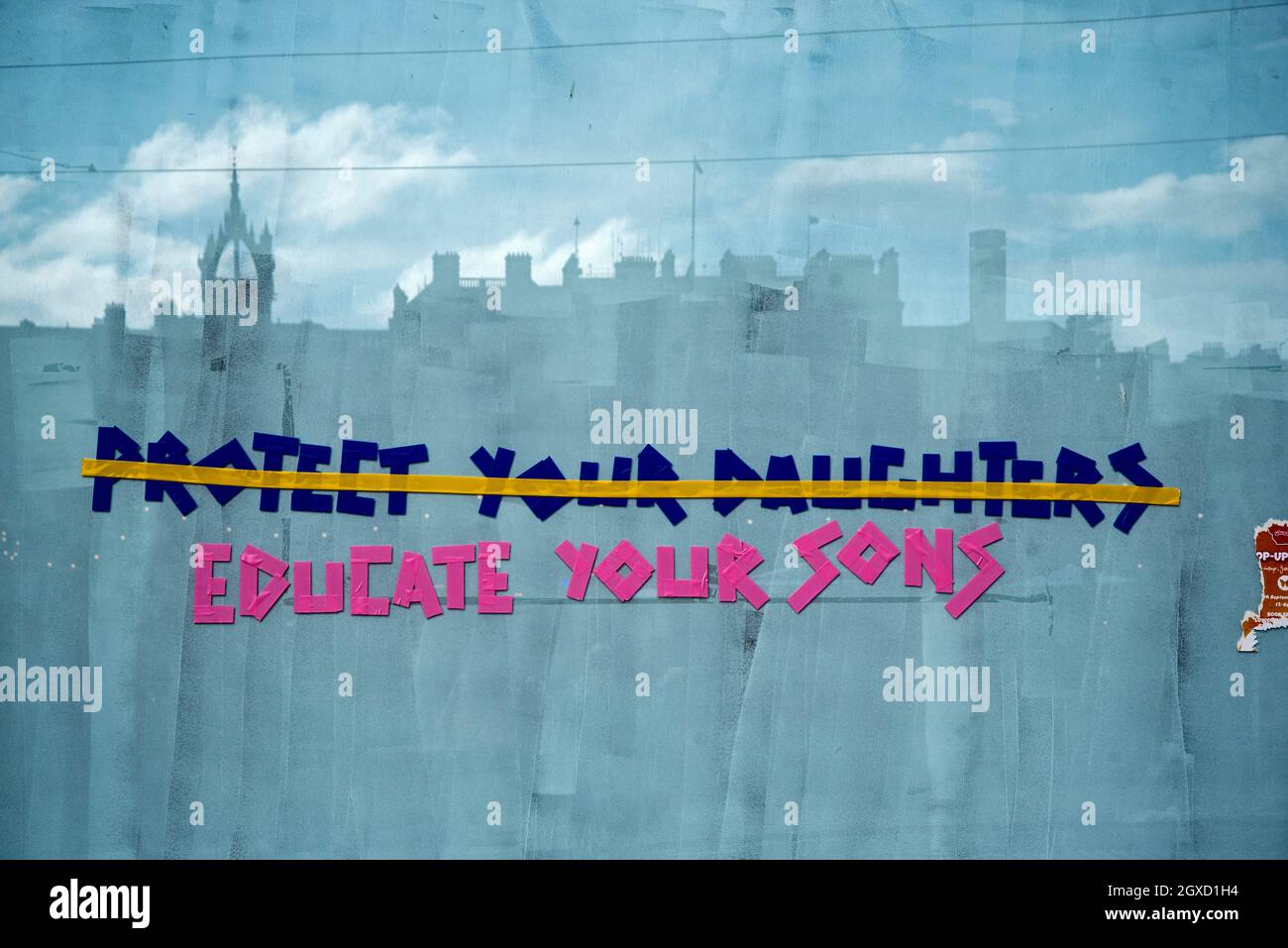 'Protect your daughters, educate your sons' graffiti on a vacant shop on Princes Street, Edinburgh, Scotland, UK. Stock Photo