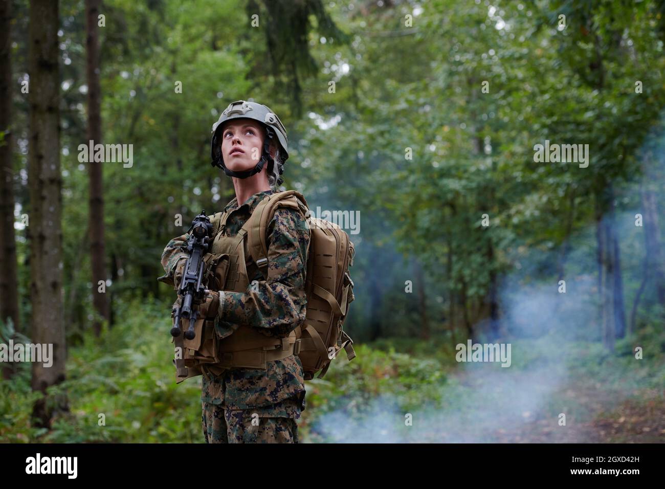 woman soldier ready for battle wearing protective military gear and