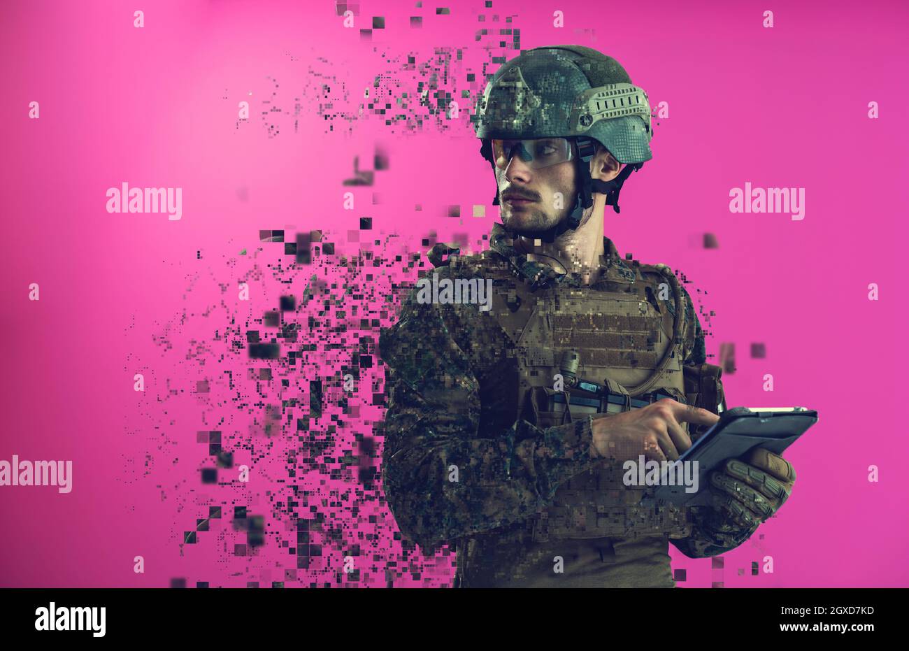 soldier using tablet computer hands closeup pnk background Stock Photo
