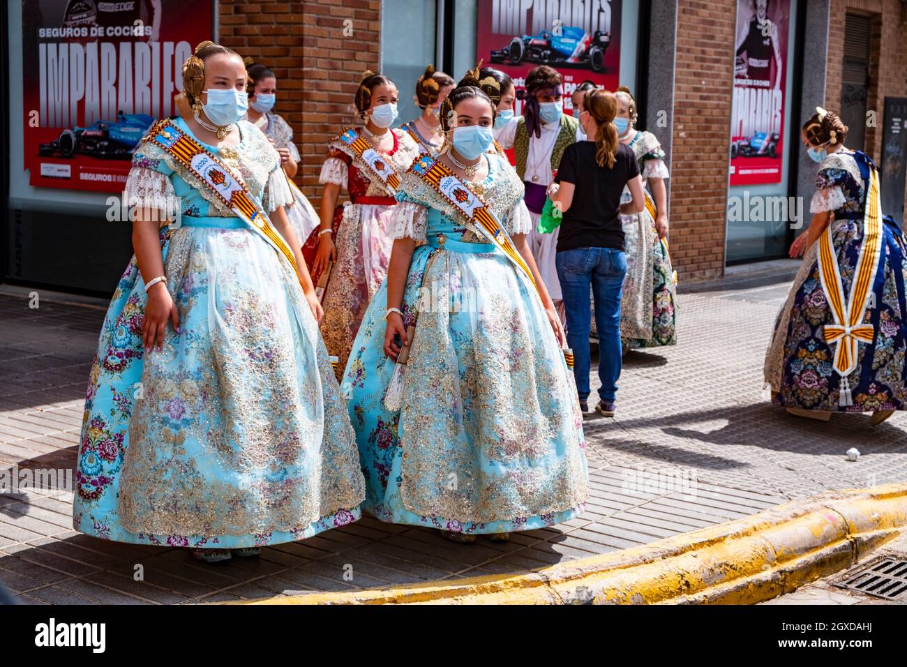 Falleras with mask. Torrent. Spain. Fallas September 2021. 500 days later,  fallas returns to the street. Fallas festival 2020 was cancelled because  Stock Photo - Alamy