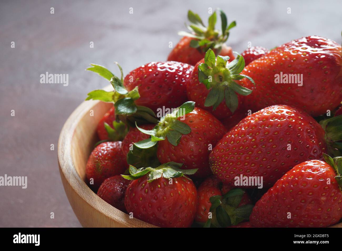 Fresh strawberries in a bowl. Healthy food Stock Photo - Alamy