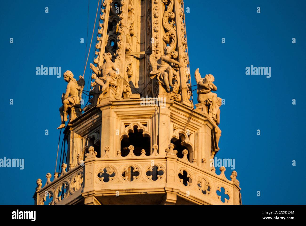 Detail of the Madonnina spire (lantern spire). Milan Cathedral (Duomo di Milano). Piazza del Duomo, Milan, Lombardy, Italy, Europe. Stock Photo