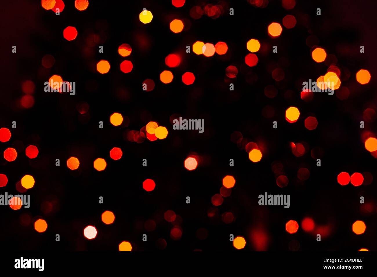 Various blurry red lights on black background. Stock Photo
