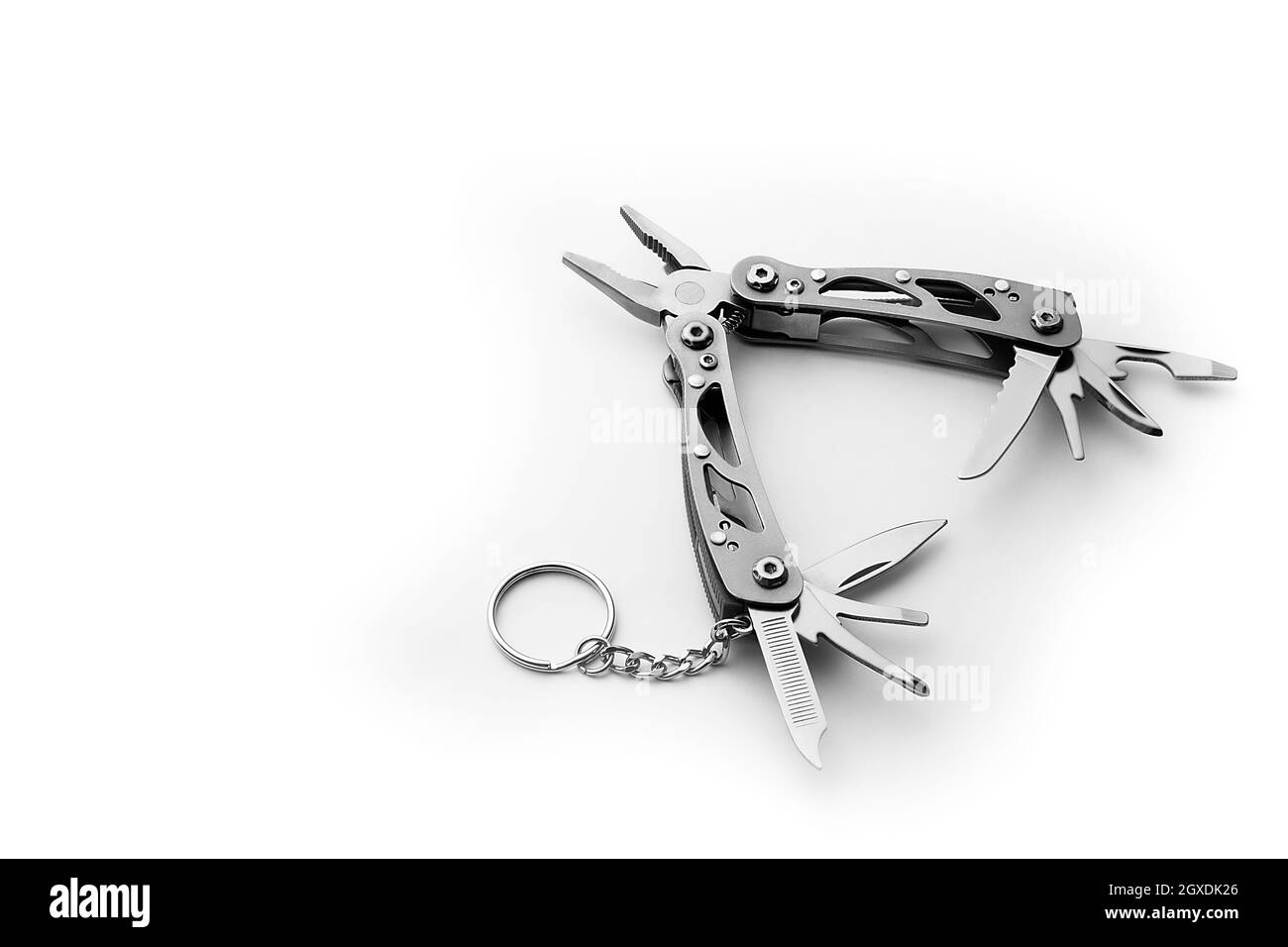 Multi tool with expanded tools and pliers isolated on a white ...