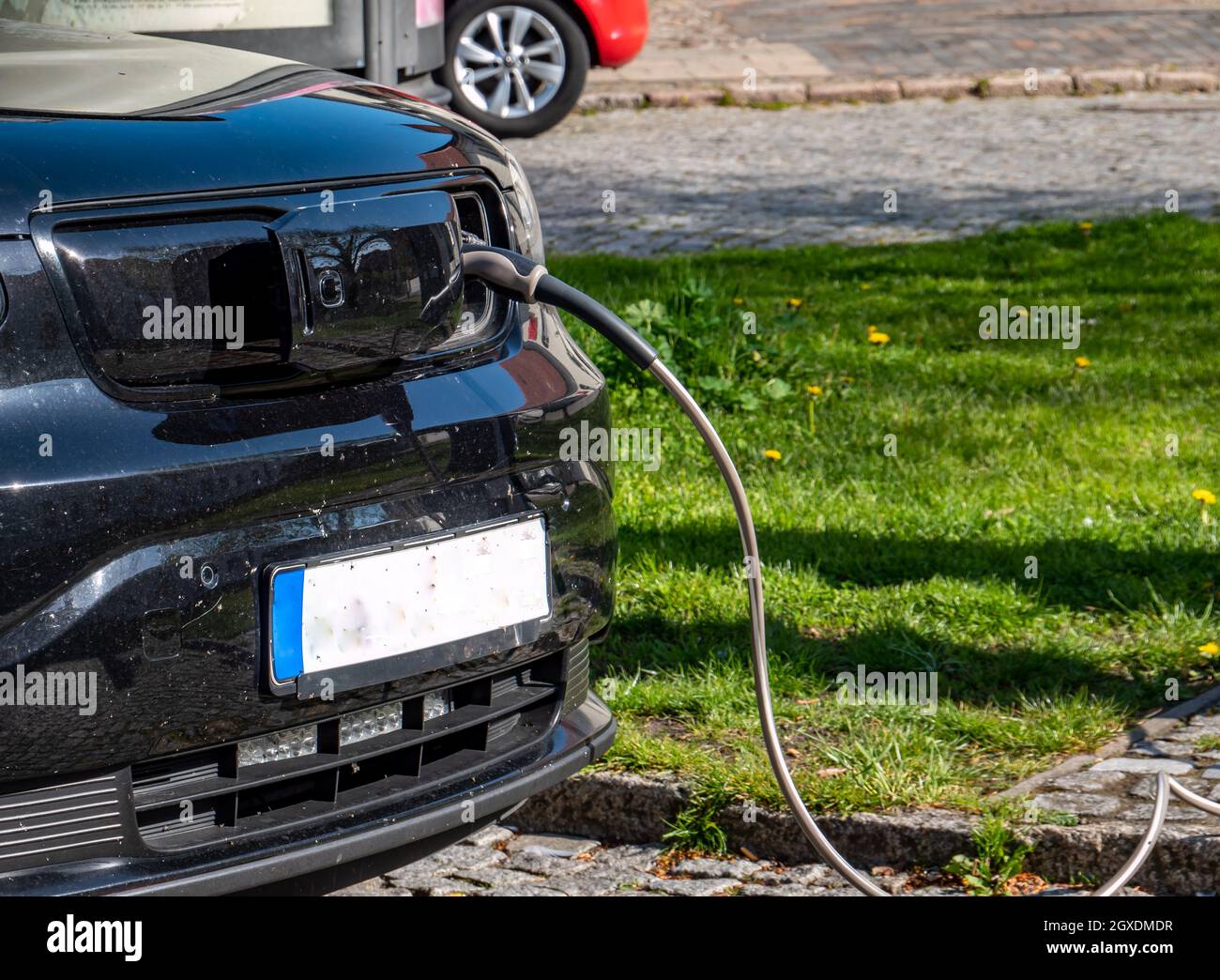 Charging an electric car at the charging station Stock Photo Alamy