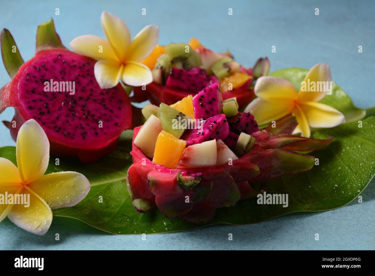 Dragon Fruit Pitaya Pitahaya Sliced Pieces Pitahaya Fruit And Fruit Salad And Frangipani Flowers Stock Photo Alamy