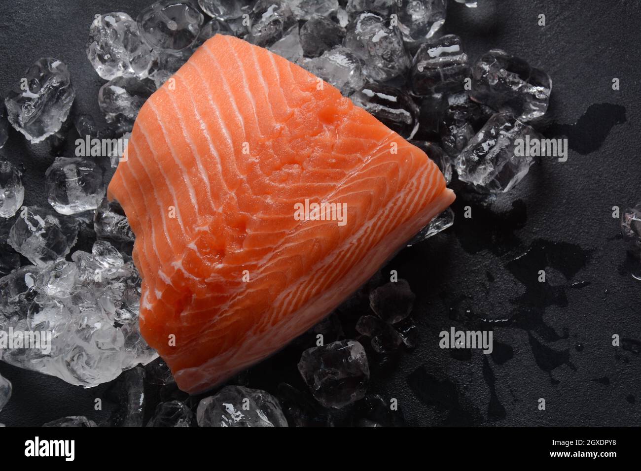 Raw salmon fillet on ice background Stock Photo - Alamy