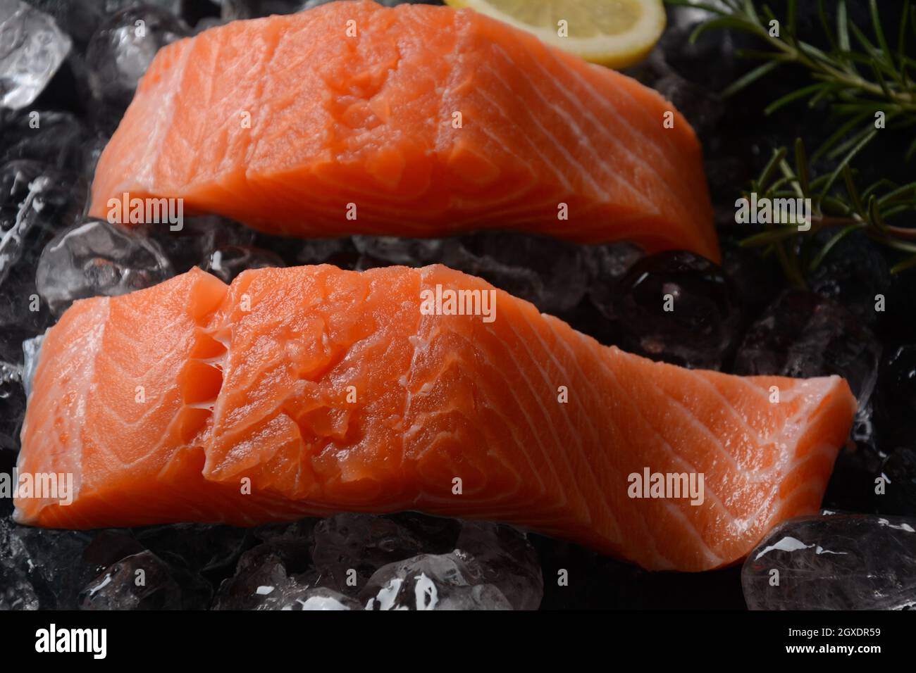 Raw salmon steaks on ice background Stock Photo - Alamy