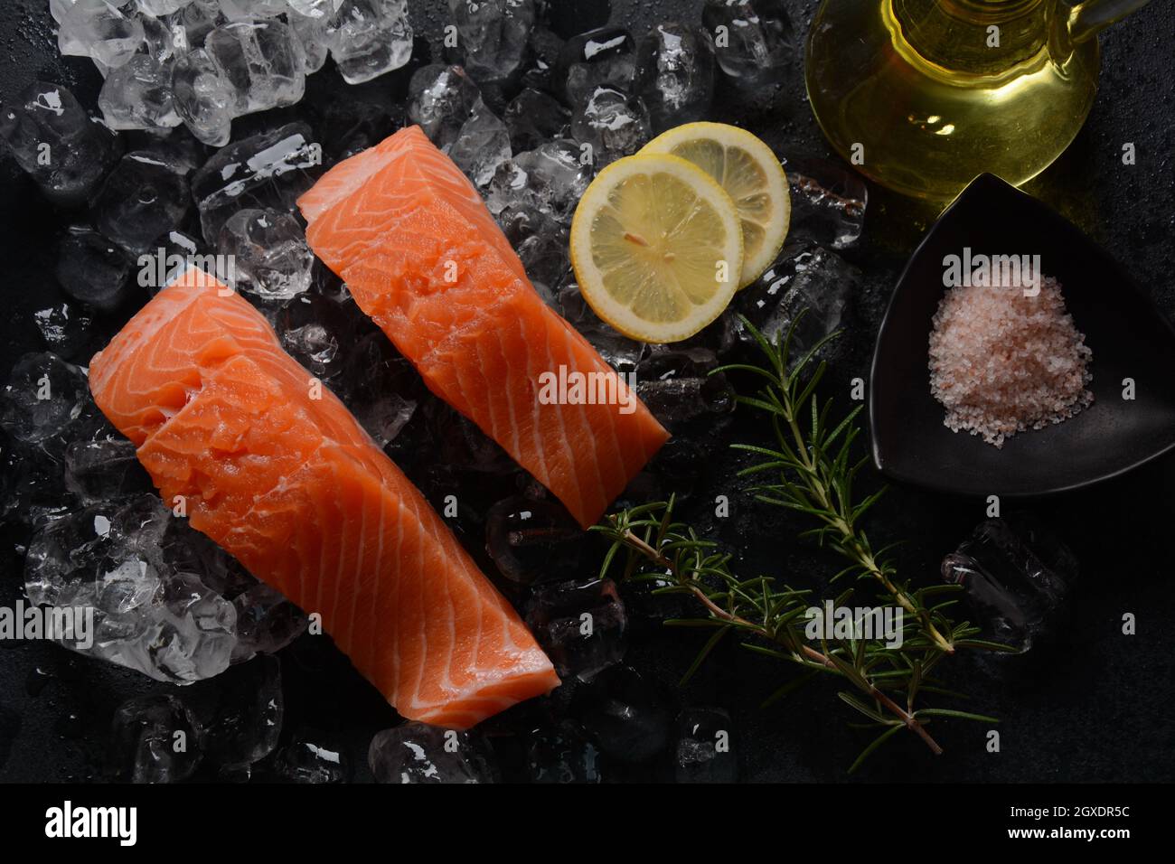 Raw salmon steaks on ice background Stock Photo - Alamy