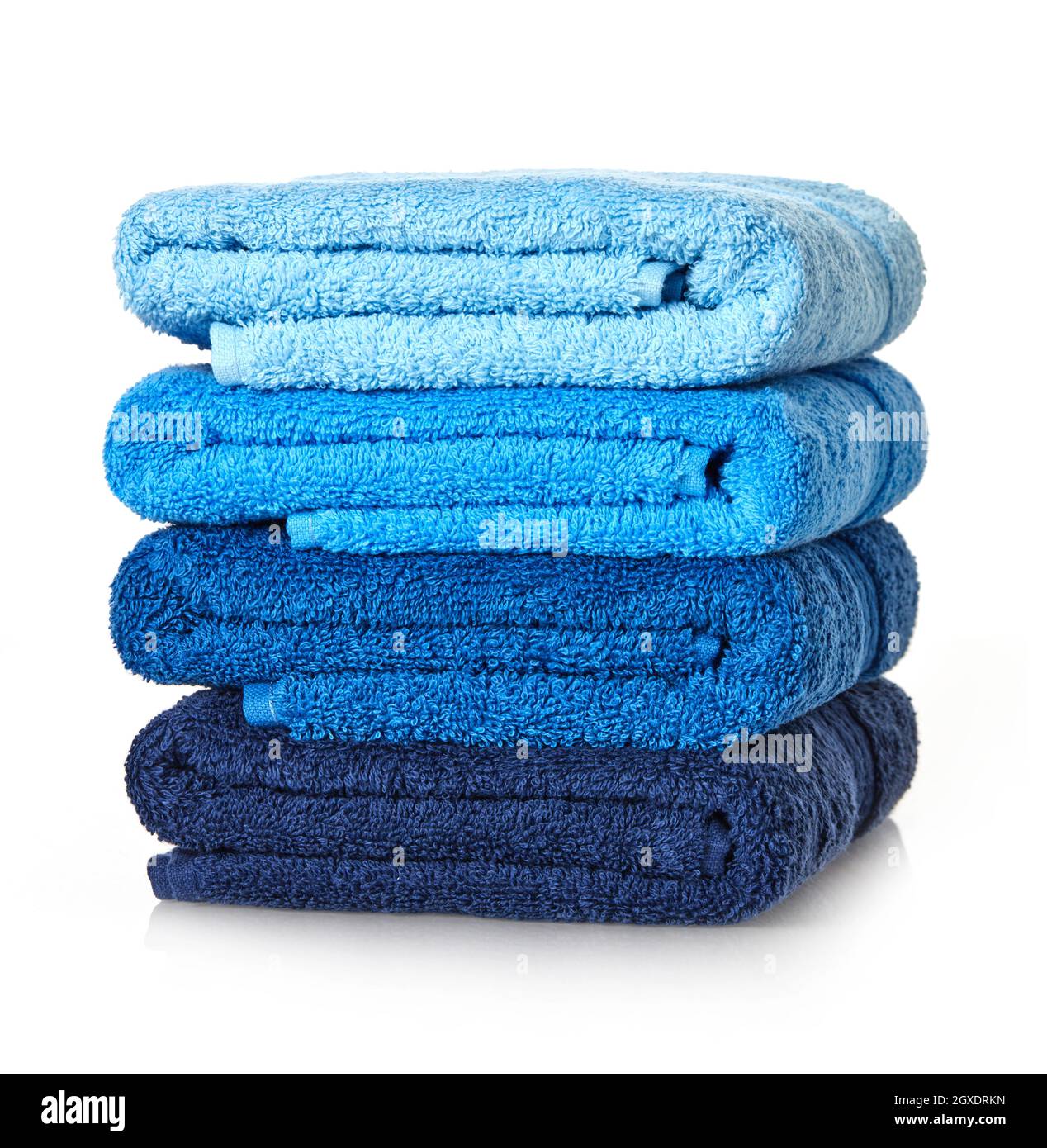 Folded stack of towels on white background Stock Photo