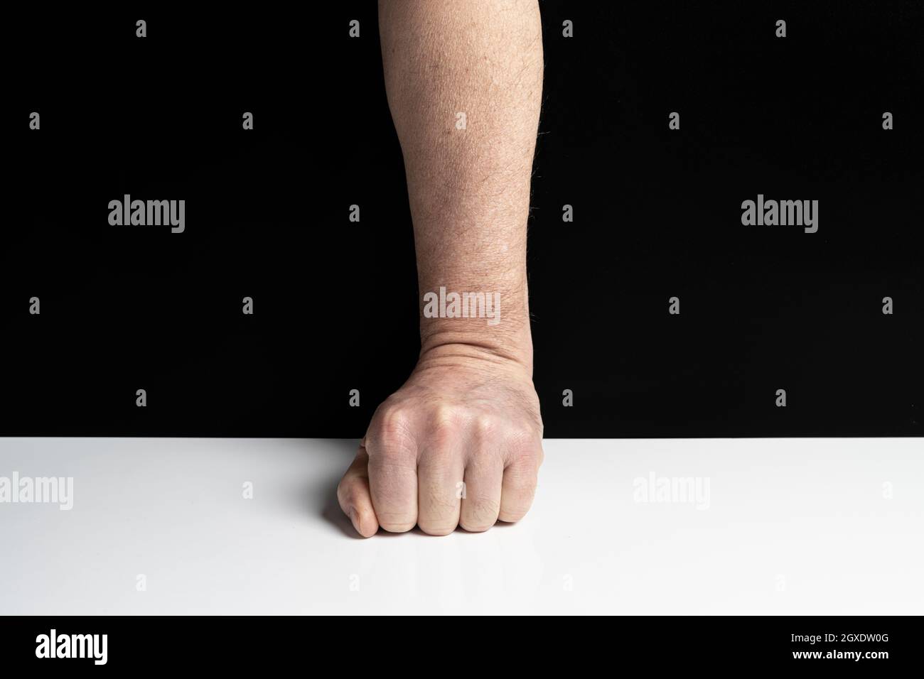 Clenched fist on table hires stock photography and images Alamy
