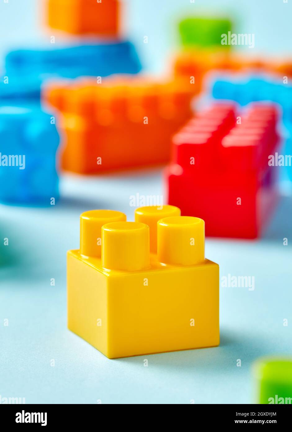 Plastic toy blocks on blue background Stock Photo