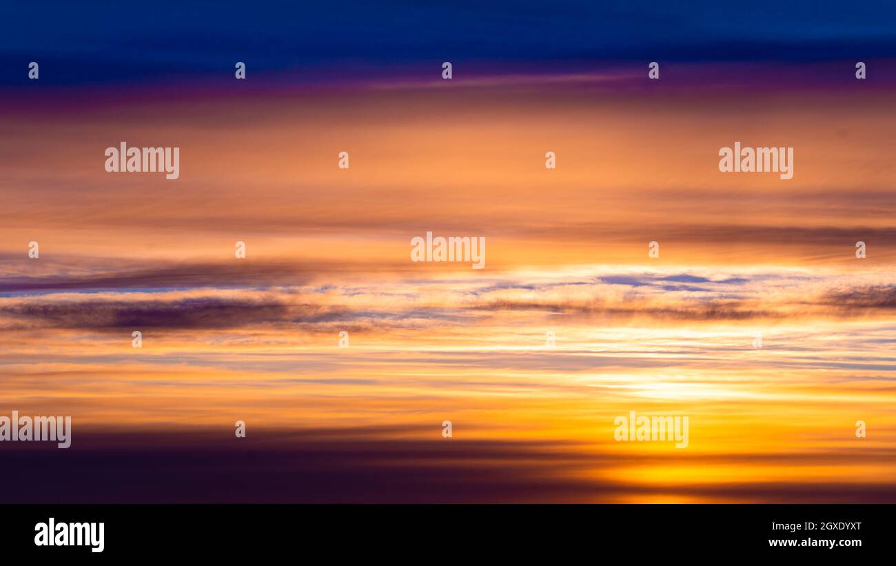 Dramatic sunset and sunrise sky. Fiery orange sunset sky Stock Photo ...