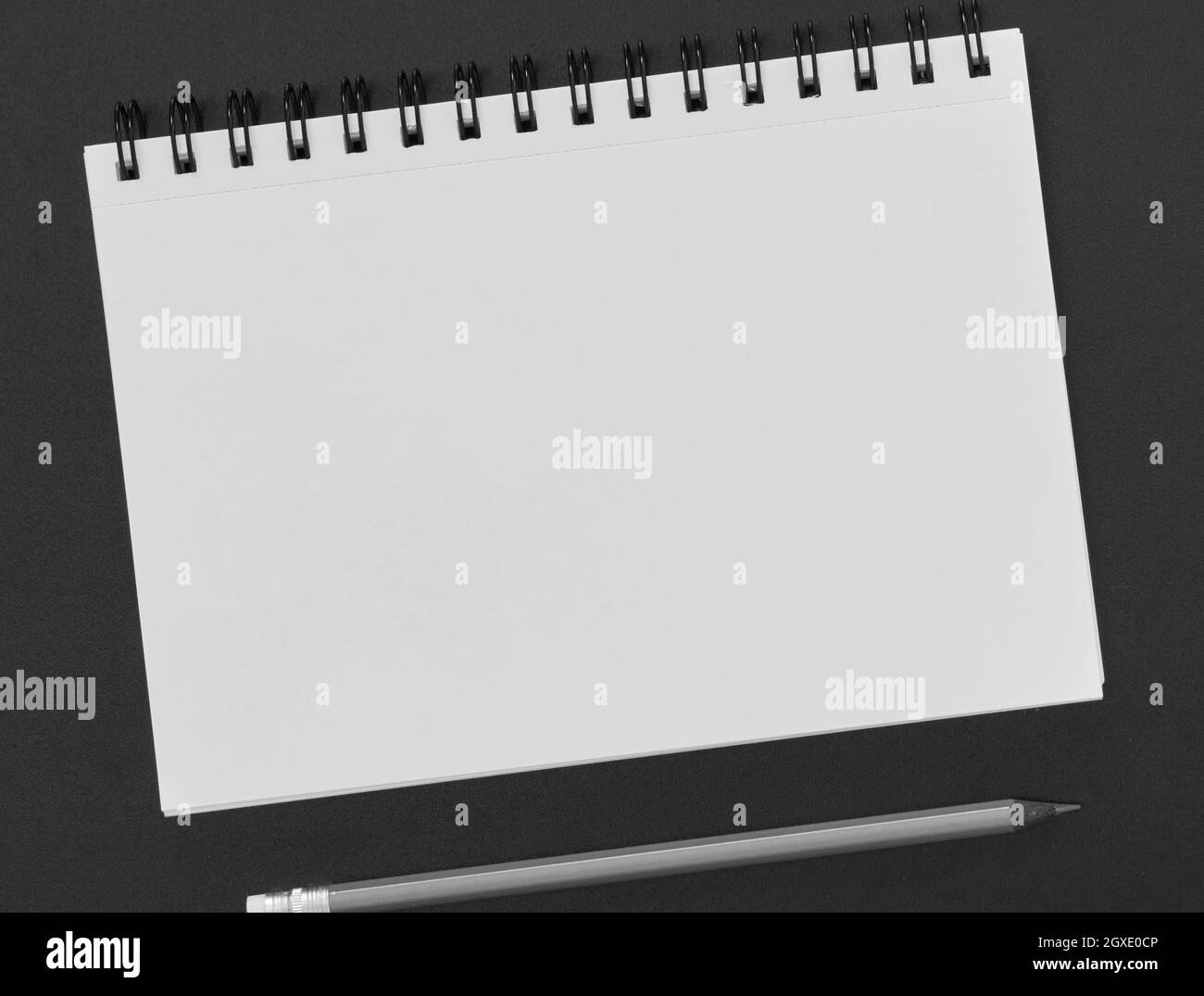 Paper notepad and pencil on blackboard Stock Photo Alamy