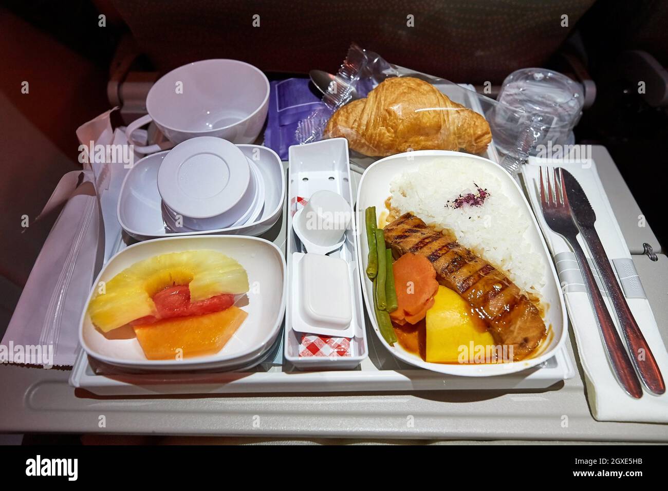 Airplane food provided on a long flight Stock Photo
