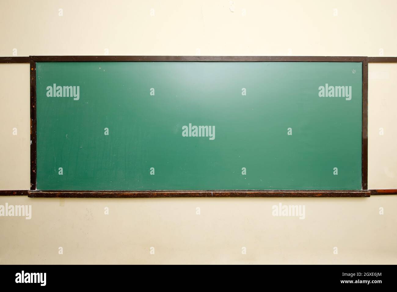 empty green blackboard in school classroom Stock Photo