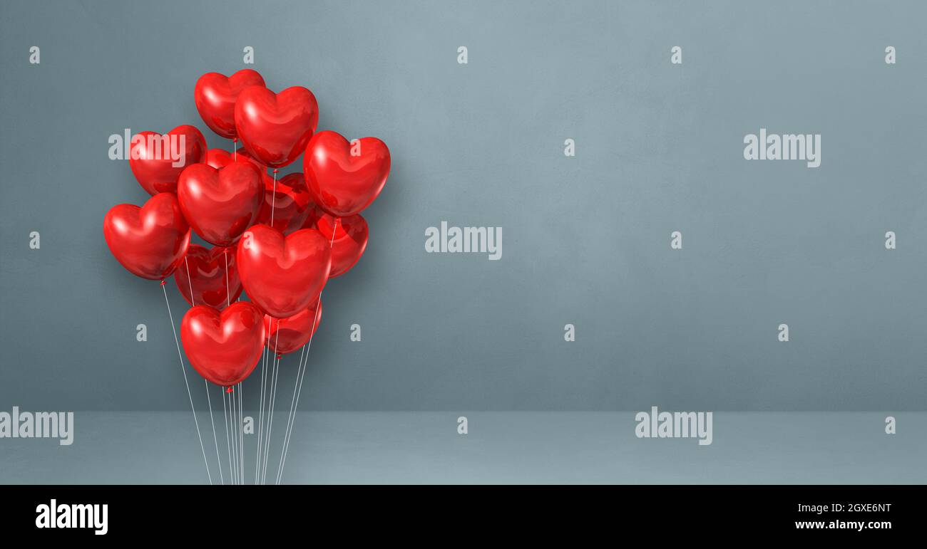 Red heart shape balloons bunch on a grey wall background. Horizontal ...