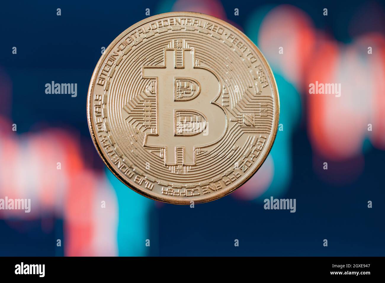Bitcoin, new Virtual money concept. Gold bitcoins with Candle stick graph chart and digital background. Golden coin with icon letter B. Mining or bloc Stock Photo