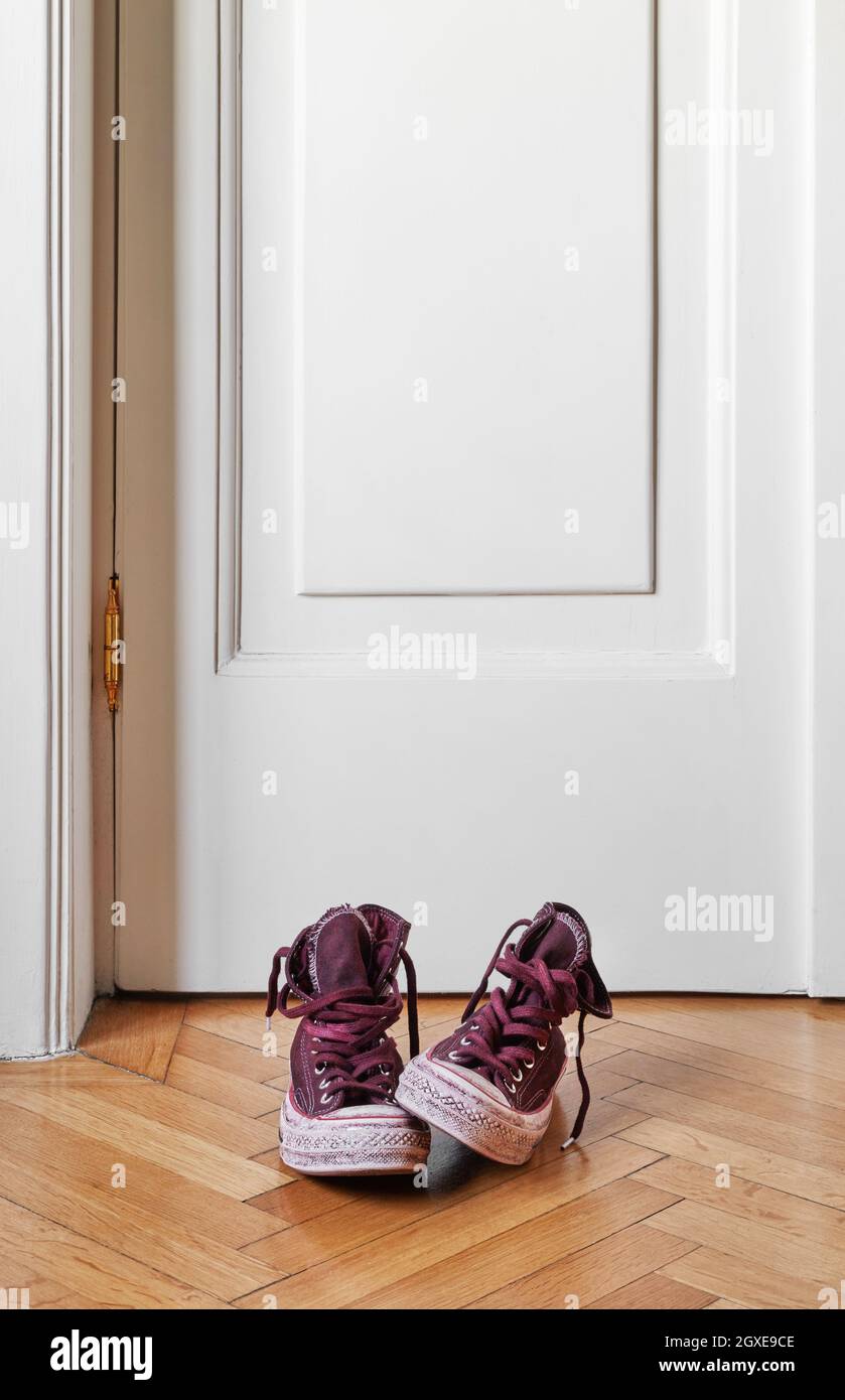 Dirty canvas shoes on floor Stock Photo - Alamy