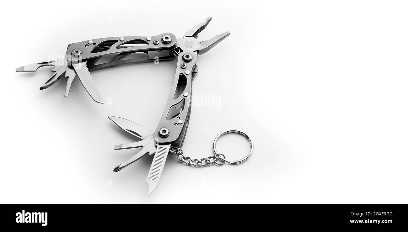 Multi tool with expanded tools and pliers isolated on a white ...