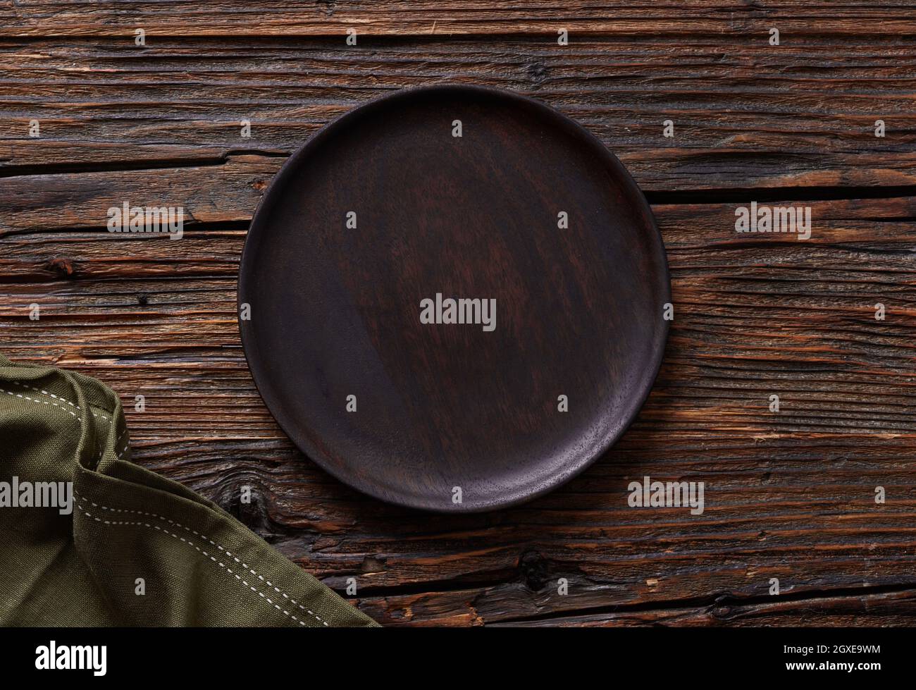 Empty plate on wooden table Stock Photo