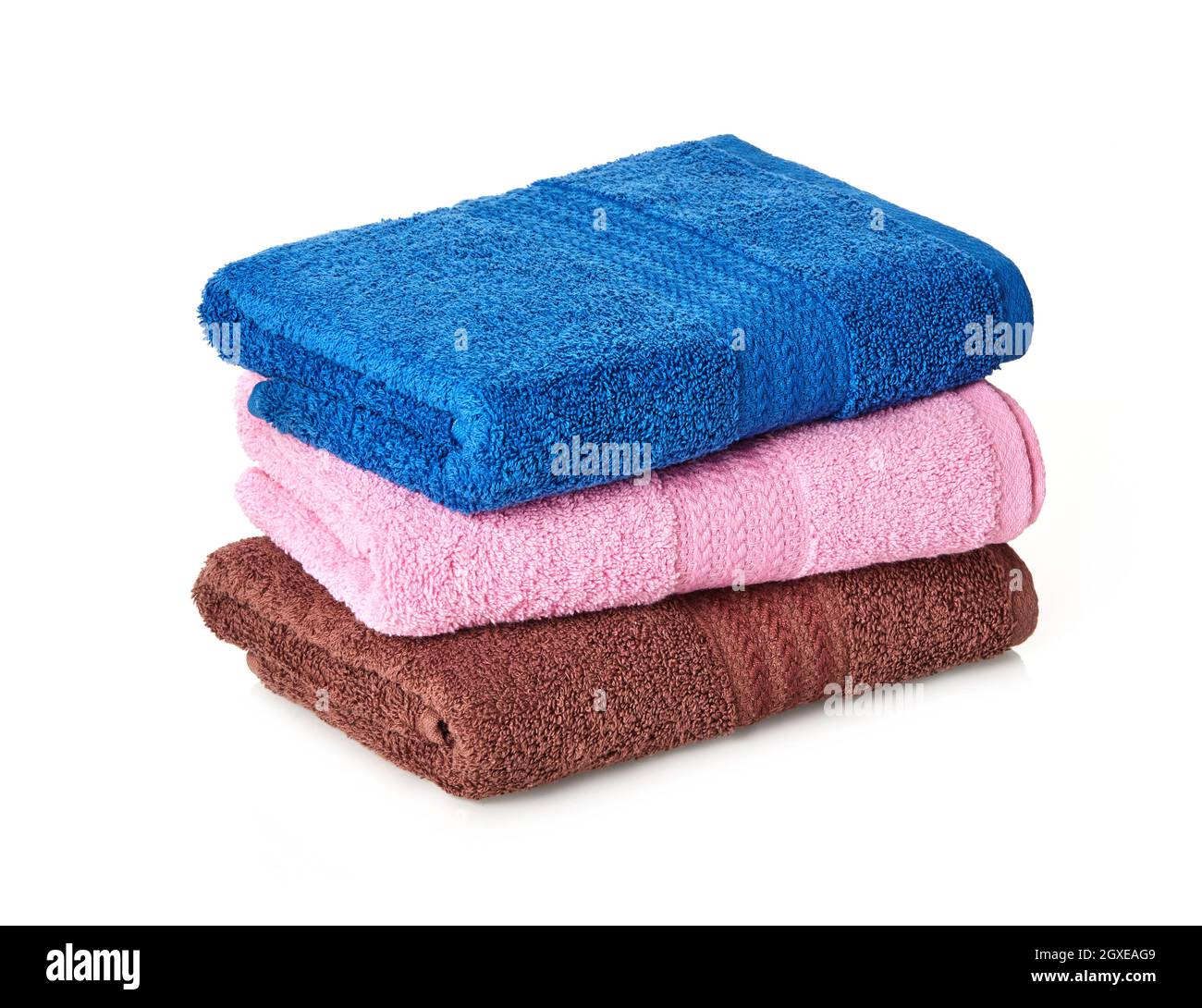 Folded stack of towels on white background Stock Photo