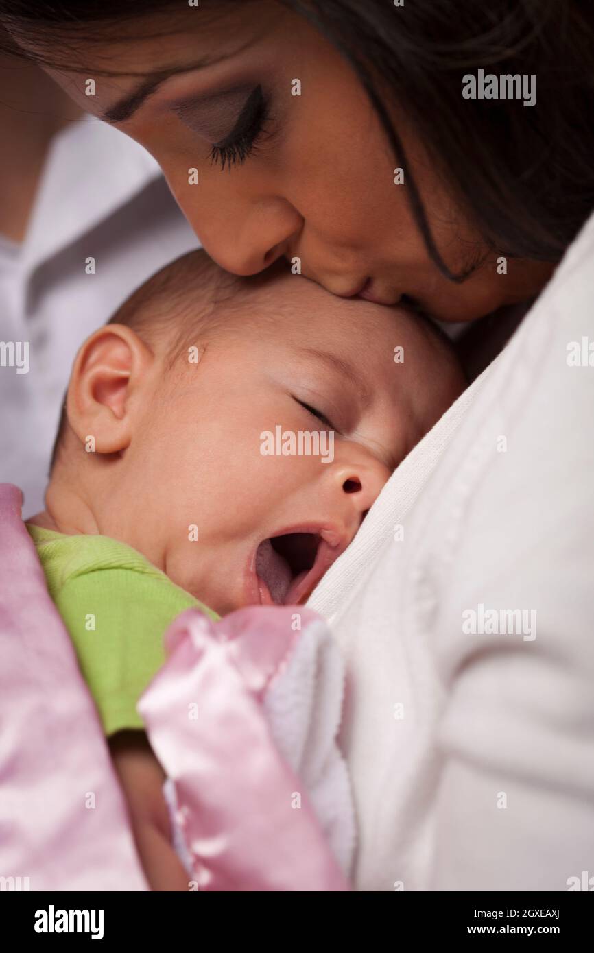 Indian woman holding baby in hi-res stock photography and images - Alamy