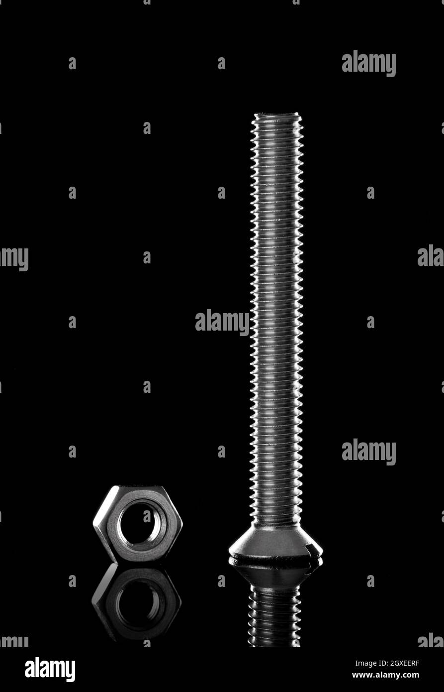 Metal bolt and nut on black background Stock Photo