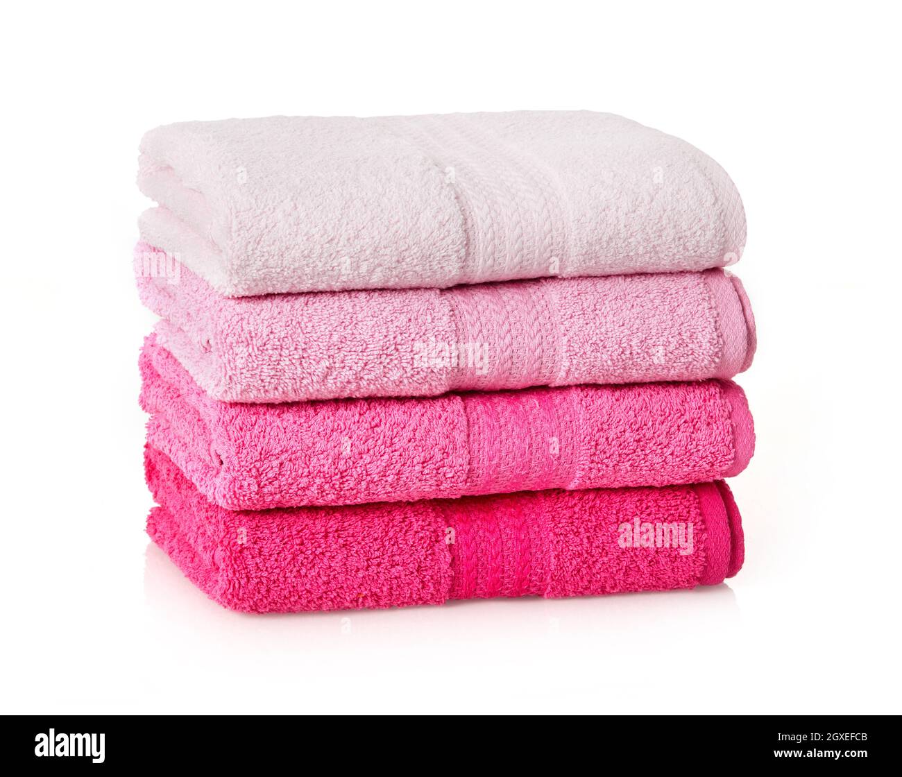 Pink towels stack on white background Stock Photo